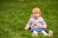 Young adorable cheerful baby playing in park