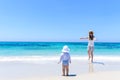 Young adorable mother having fun with little daughter at tropical beach Royalty Free Stock Photo