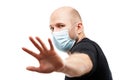Young adult bald head man wearing respiratory protective medical mask Royalty Free Stock Photo