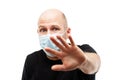 Young adult bald head man wearing respiratory protective medical mask Royalty Free Stock Photo