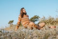 Adult man in sweater and sunglasses chilling on blanket outdoors