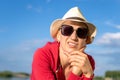 Young adult beautiful happy attractive caucasian bald shaved woman portrait in hat lookingwith puzzled facial expression against Royalty Free Stock Photo