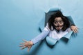 Young adult chemist with wacky look, messy hair and dirty face acting goofy after experiment explosion. Royalty Free Stock Photo