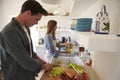 Young adult couple preparing food, looking down Royalty Free Stock Photo