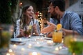 Young adult couple talking at cafe, having a drink. socializing, friends, couple, talk, fun concept Royalty Free Stock Photo