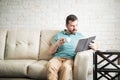 Latin man reading an exciting book