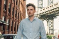 Young adult entrepreneur man walking on city street of New York City. Royalty Free Stock Photo