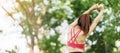 Young adult female in pink sportswear stretching muscle in the park outdoor, sport woman warm up ready for running and jogging in Royalty Free Stock Photo