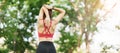 Young adult female in pink sportswear stretching muscle in the park outdoor, sport woman warm up ready for running and jogging in Royalty Free Stock Photo