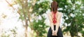 Young adult female in pink sportswear stretching muscle in the park outdoor, sport woman warm up ready for running and jogging in Royalty Free Stock Photo