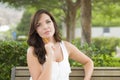 Young Adult Female Student on Bench Outdoors Royalty Free Stock Photo