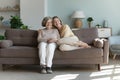 Young adult granddaughter hugs joyful retired older grandmother Royalty Free Stock Photo