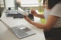 Young adult happy smiling Hispanic Asian student wearing headphones talking on online chat meeting using laptop in university Royalty Free Stock Photo