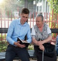 Young man preaching to an old woman Royalty Free Stock Photo