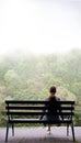Lonely girl on a bench by the lake Royalty Free Stock Photo
