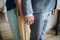 Young adult male groom and female bride holding hands Royalty Free Stock Photo