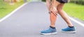 Young adult male with his muscle pain during running. runner man having leg ache due to Calf muscle pull. Sports injuries and