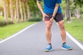 Young adult male with muscle pain during running. runner have leg ache due to Iliotibial Band Syndrome Ã¢â¬â ITBS. Sports injuries Royalty Free Stock Photo