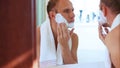 Young adult man foamed face before shaving