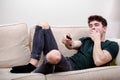 A young adult man on a sofa Royalty Free Stock Photo