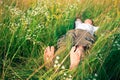 Young adult man in spring grass Royalty Free Stock Photo