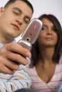 Young Adult Man And Woman With Cell Phone Royalty Free Stock Photo