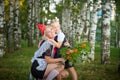 Young and adult schoolgirl on September 1 with flowers. Generations of schoolchildren of USSR and Russia. Female pioneer