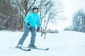 young adult smiling woman skiing down by hill Royalty Free Stock Photo