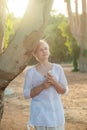 Young adult teen girl listening music with headphones from a smart phone outdoors Royalty Free Stock Photo