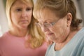 Young Woman Consoles Senior Adult Female Royalty Free Stock Photo