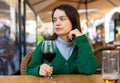 Young adult woman drinking wine at restaurant Royalty Free Stock Photo