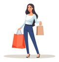 Young adult woman holding shopping bags and smiling. Fashionable shopper enjoying retail therapy. Retail shopping spree