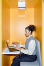 Young Adult Woman Using Laptop in Library Royalty Free Stock Photo