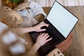 Young adult woman using modern laptop computer at home Royalty Free Stock Photo