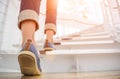 Young adult woman walking up the stairs Royalty Free Stock Photo