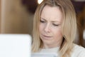 Young adult woman working on laptop Royalty Free Stock Photo