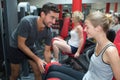 Young adult woman working out with personal trainer Royalty Free Stock Photo