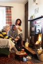 Young adults making toast on open fire Royalty Free Stock Photo