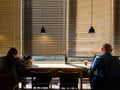 Young adults officer working or relaxing at coffee shop cafe,listenning music, reading newspaper, Hipster style,Freelance and slow