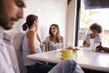 Young adults relaxing at a coffee shop, close up