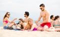 Young adults sunbathing on beach