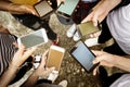 Young adults using smartphones in a circle social media and conn Royalty Free Stock Photo