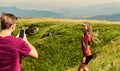 Young adventurers. Couple taking photo. Couple in love hiking mountains. Lets take photo. Capturing beauty. Man and