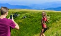 Young adventurers. Couple taking photo. Couple in love hiking mountains. Lets take photo. Capturing beauty. Man and Royalty Free Stock Photo