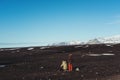 Young adventurous couple taking a break while traveling in Iceland at wintertime. Couple lifestyle concept Royalty Free Stock Photo