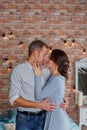 Young affectionate couple kissing tenderly in studio Royalty Free Stock Photo