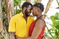 Young afircan american couple smiling happy and hugging at the city