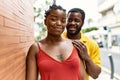 Young afircan american couple smiling happy and hugging at the city