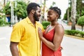 Young afircan american couple smiling happy and hugging at the city