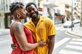 Young afircan american couple smiling happy and hugging at the city